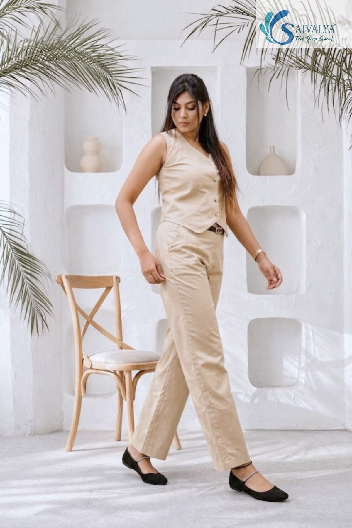 Side product views of the Aatman Waistcoat and Straight Trousers Set in beige. The waistcoat features a V-neckline with a four-button closure and a pointed hem, while the matching trousers show a clean, tailored back with a standard waistband and straight-leg silhouette.