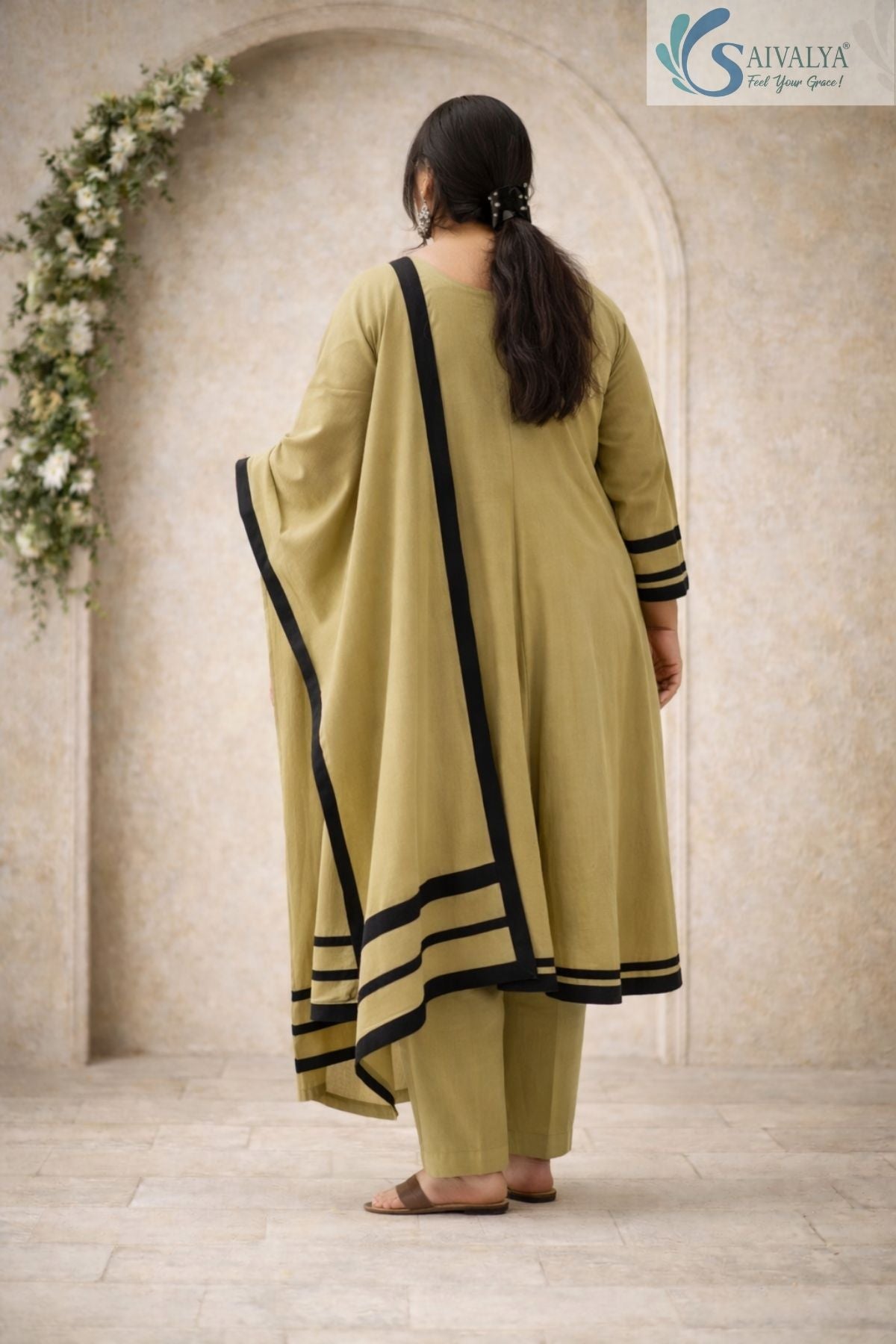 Back view of a woman wearing the Saivalya Olive Zenith Scalloped Suit Set showcasing the long draped dupatta with black contrast borders and matching trousers