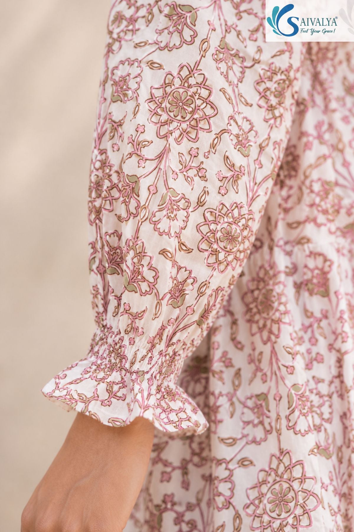 Close-up sleeve detail of Bloom & Breezy Peplum Co-ord Set featuring pink floral print, gathered cuff sleeves and soft cotton ethnic wear fabric design by Saivalya.