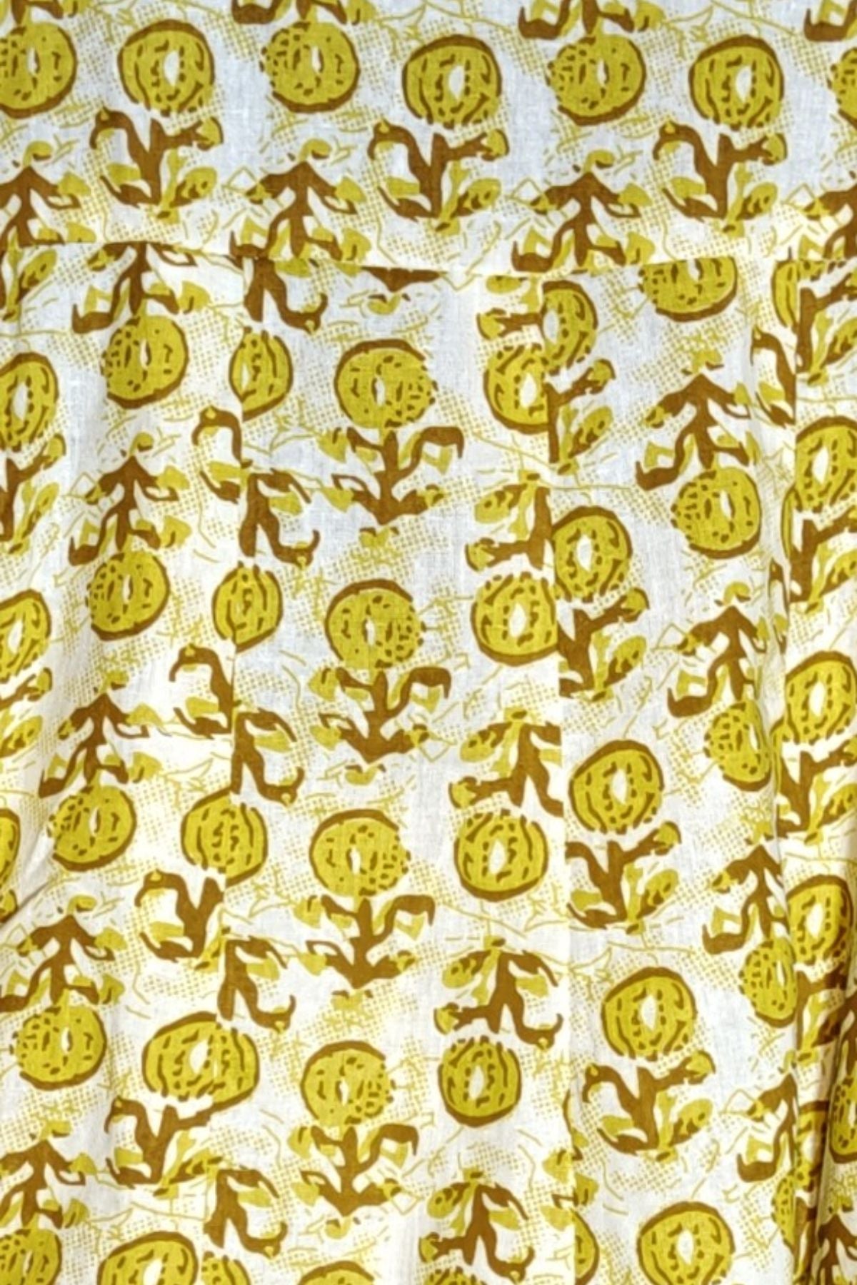 Close-up view highlighting the detailed olive-yellow and brown block-style floral print on white cotton fabric from the Citrus Blossom Kalidar Kurta Set.
