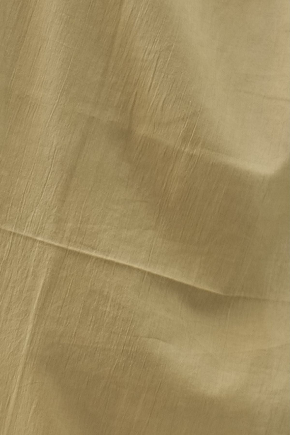 Close up shot of the Saivalya Olive Zenith Scalloped Suit Set fabric highlighting the fine textured weave and high quality olive green material detail