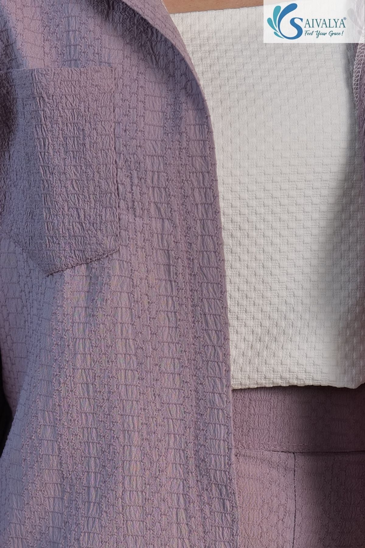 Close-up view highlighting the distinctive puckered, seersucker-style fabric texture of the dusty lavender button-up shirt and matching shorts, layered over a white textured knit crop top.