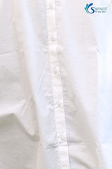 Close-up of a white shirt with a brand logo in the corner