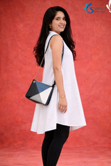 Side view of woman wearing Saivalya white pure cotton sleeveless high-low tunic with mandarin collar and button-down front