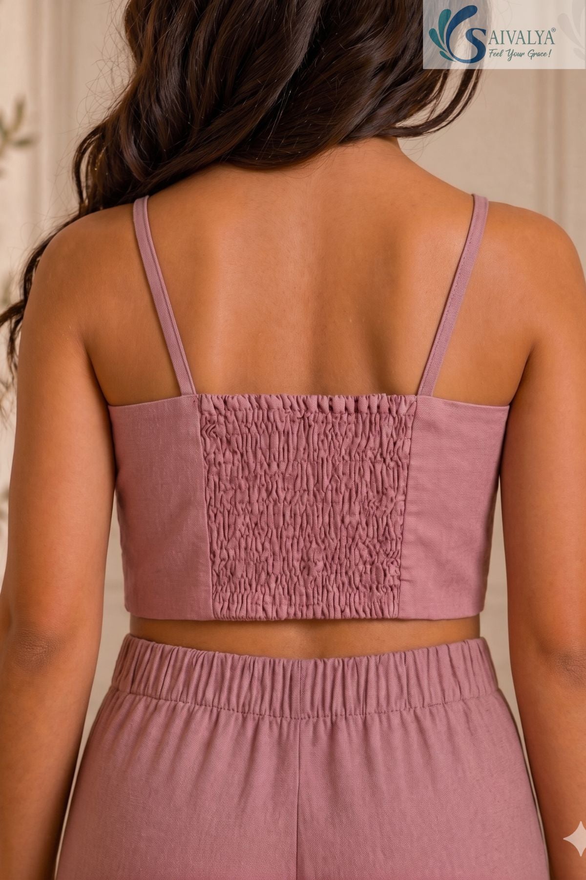 Close-up back view of a mauve pink crop top highlighting the stretchy smocked back panel and spaghetti straps from the Rose Bloom set.