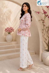 Side view of Bloom & Breezy Peplum Co-ord Set featuring floral printed peplum top with full sleeves and white straight palazzo pants for women ethnic casual wear by Saivalya.