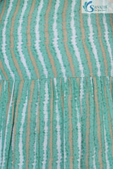 close view of the Saivalya Verdant Muse green striped tiered midi dress featuring a square neckline and adjustable noodle straps against a white background